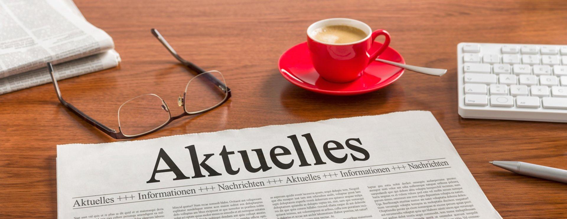 Zeitung auf Schreibtisch - Aktuelles