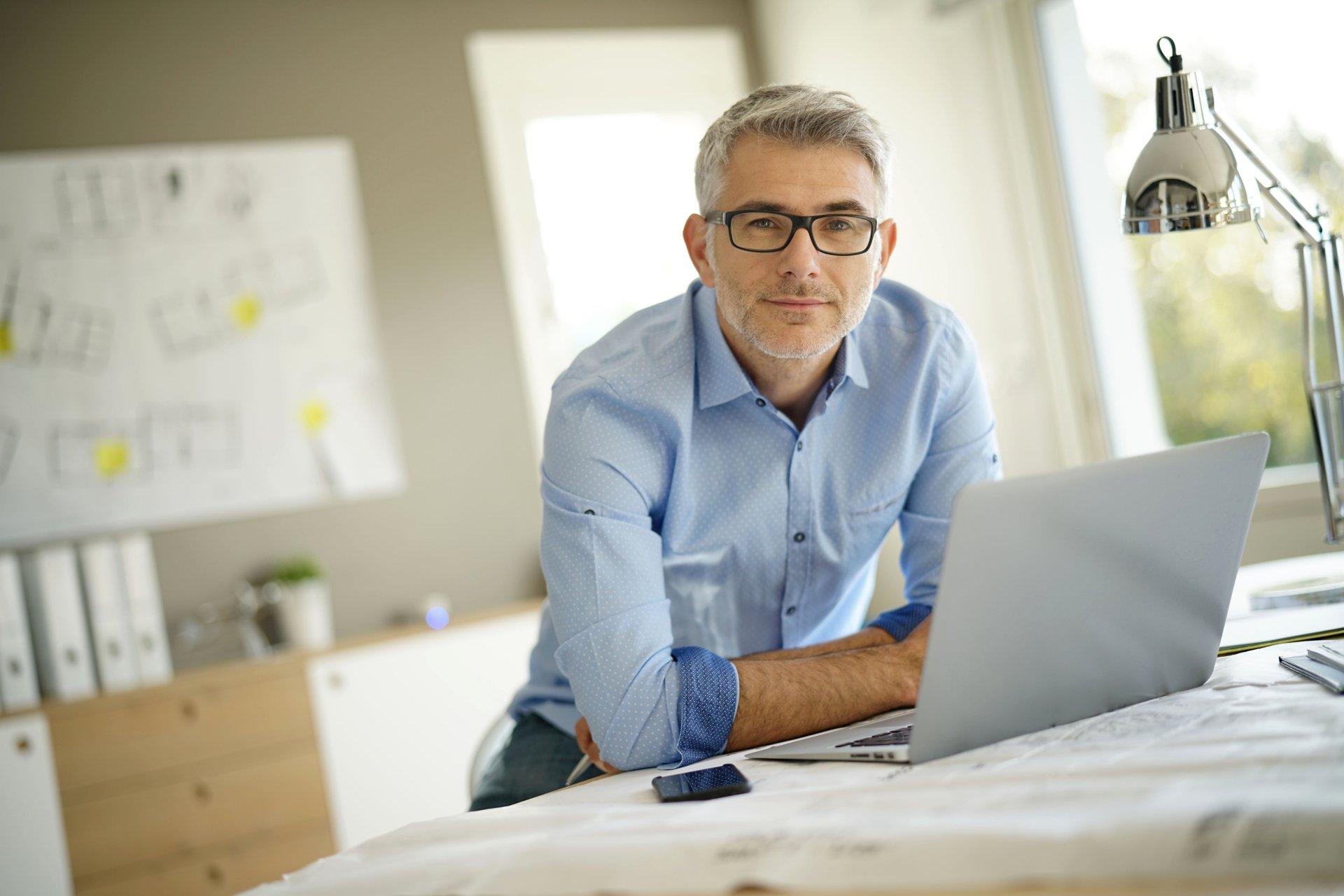 Portrait of architect looking at camera in office