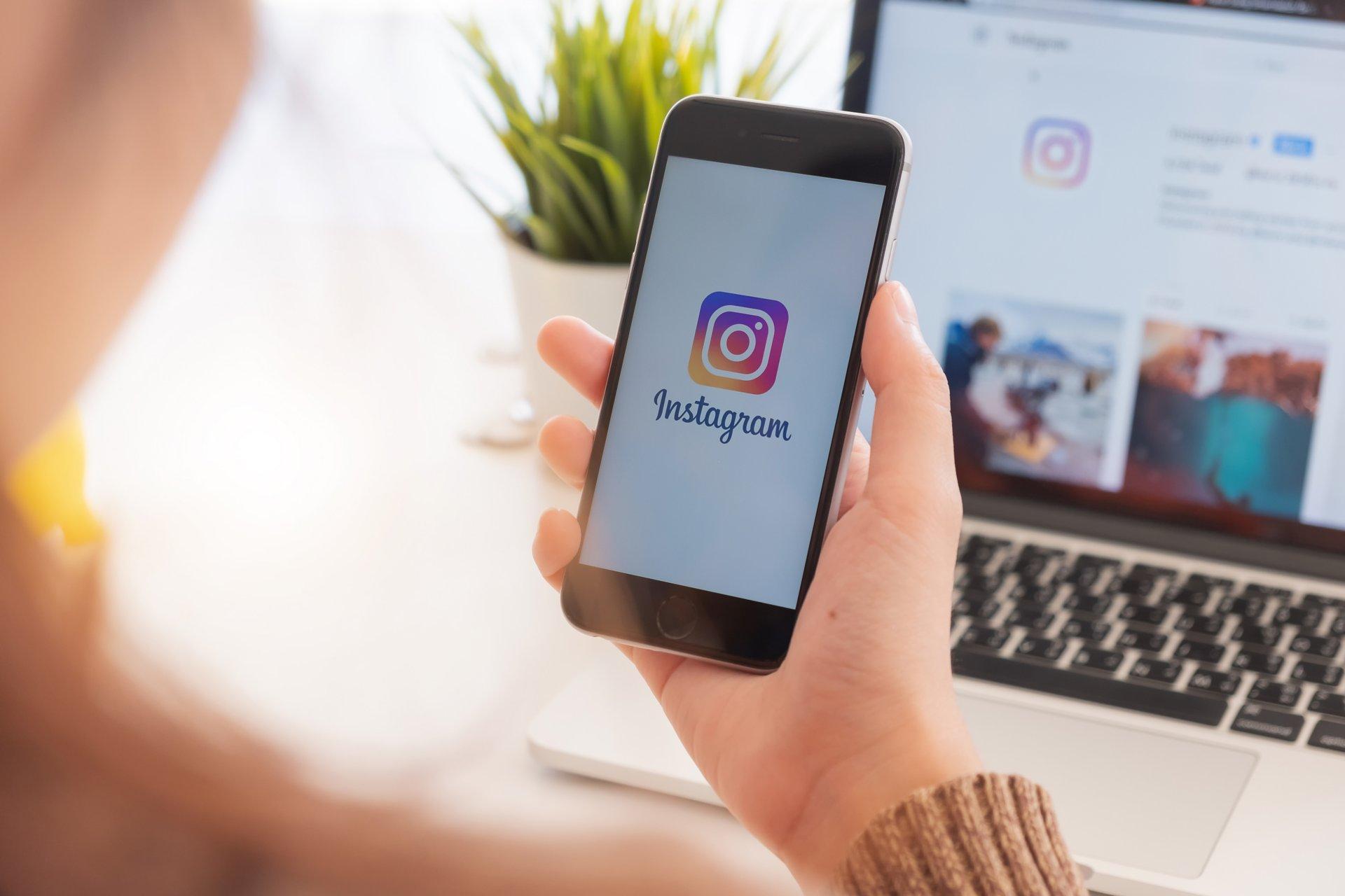 CHIANG MAI, THAILAND - FEB 24  2019: A woman holds Apple iPhone 6s with Instagram application on the screen at cafe. Instagram is a photo-sharing app for smartphones